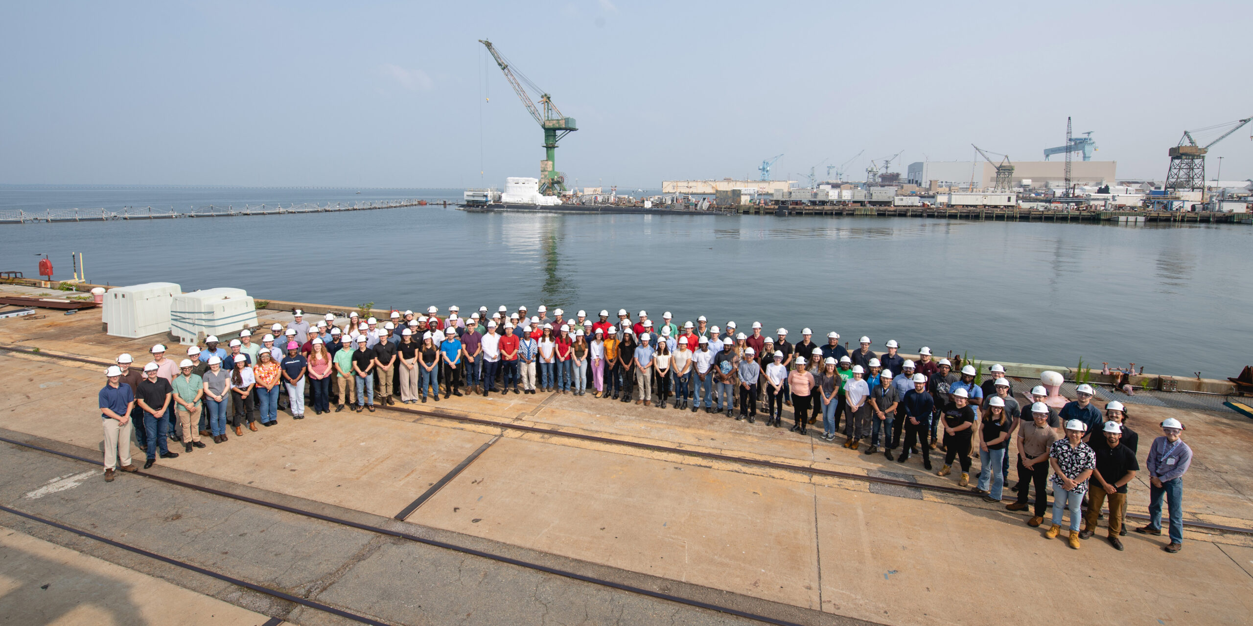 Summer interns on Pier 5 with New Jersey SSN 796 in the background
