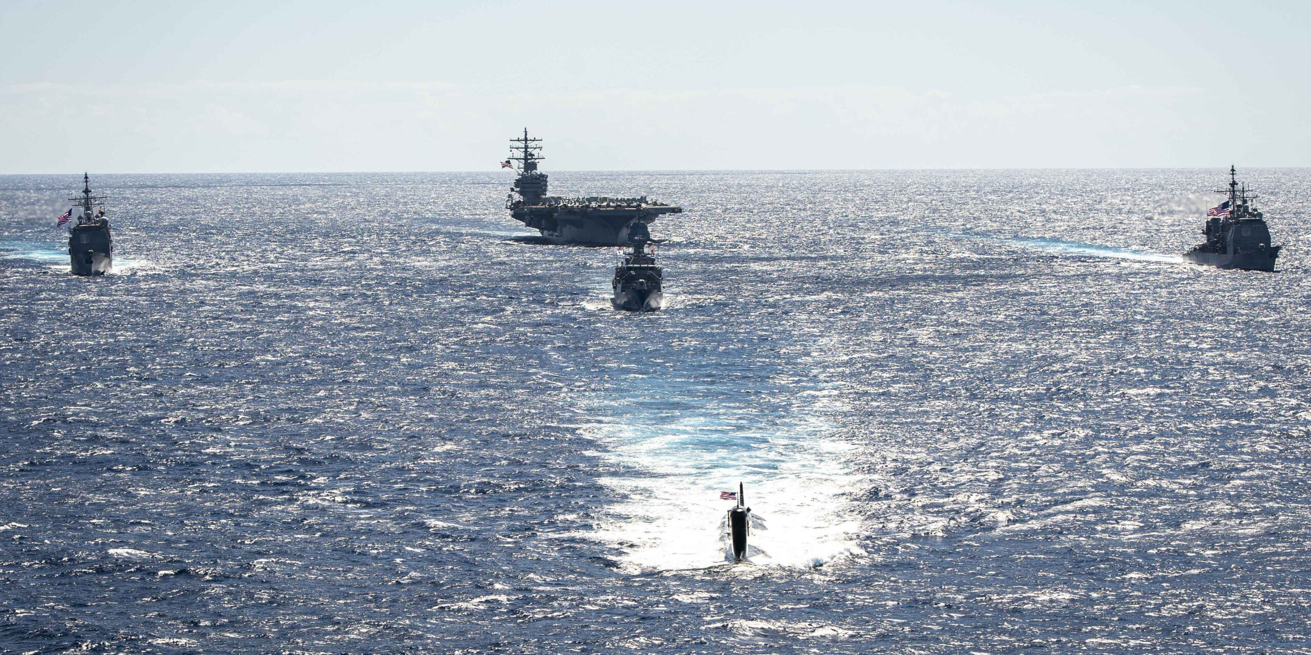USS Ronald Reagan (CVN 76) sails in formation with HMAS Perth during Talisman Sabre 23